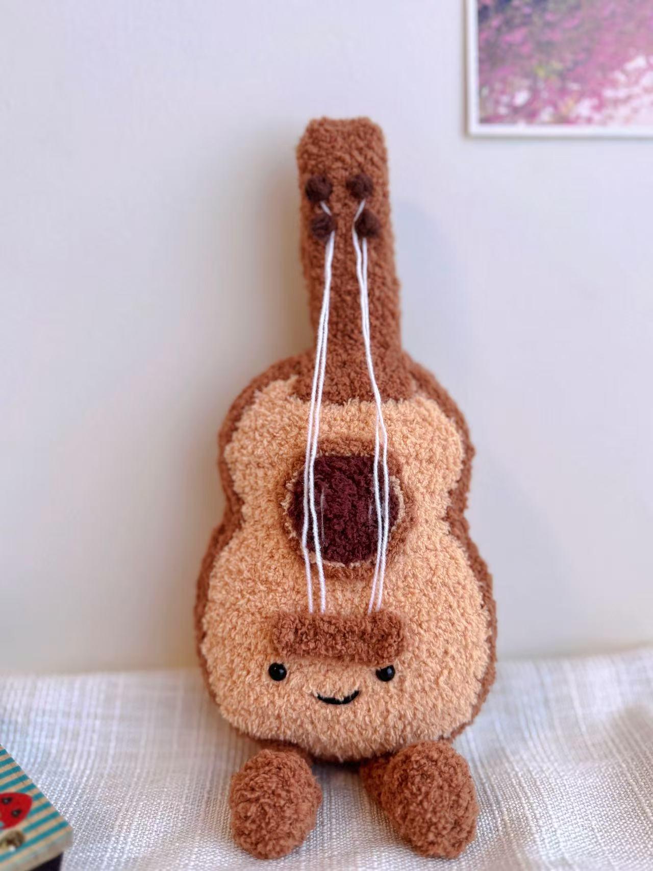 Mini Guitar Plushie Crochet Pattern – finished amigurumi made with plush yarn
