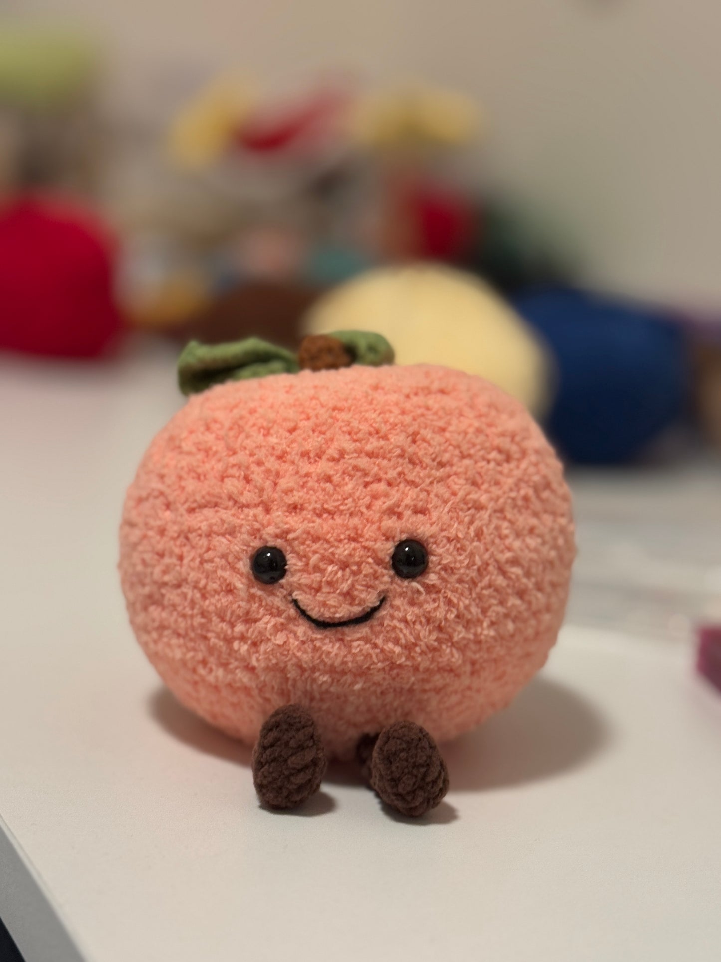 Peach Plushie Crochet Pattern – finished amigurumi made with plush yarn