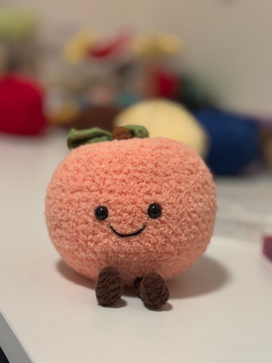 Peach Plushie Crochet Pattern – finished amigurumi made with plush yarn
